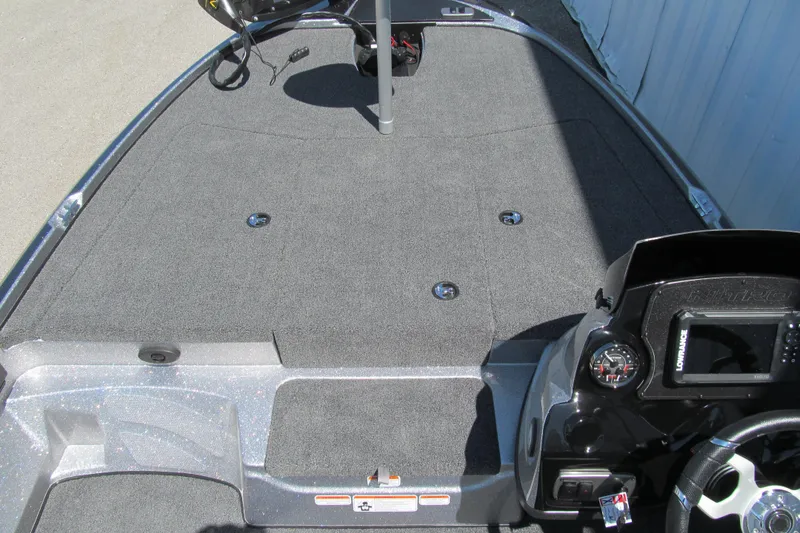 Slide: The Image of 2026 Nitro Z17 boat deck with steering console and carpeted surface. - 6