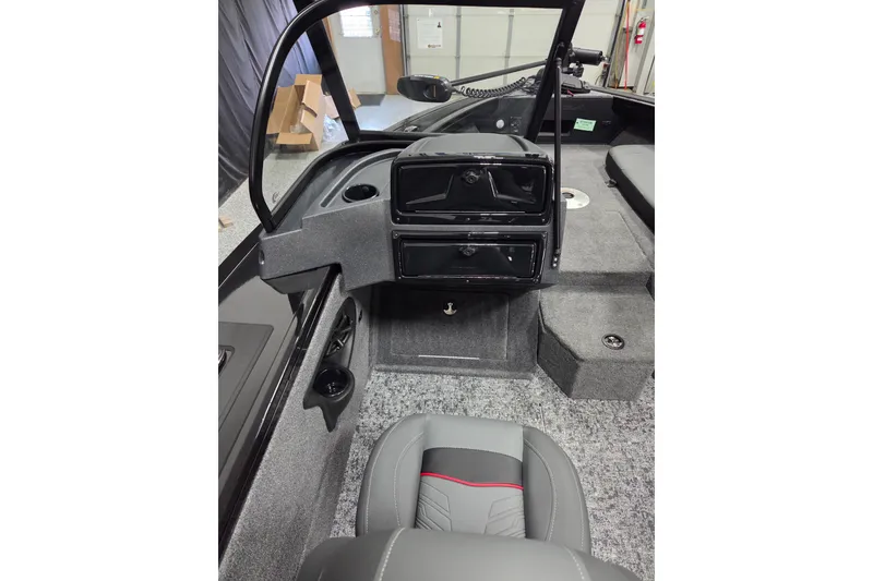 Slide: The Image of 2026 Tracker Targa V-18 Combo boat dashboard with steering wheel and Lowrance display. - 7