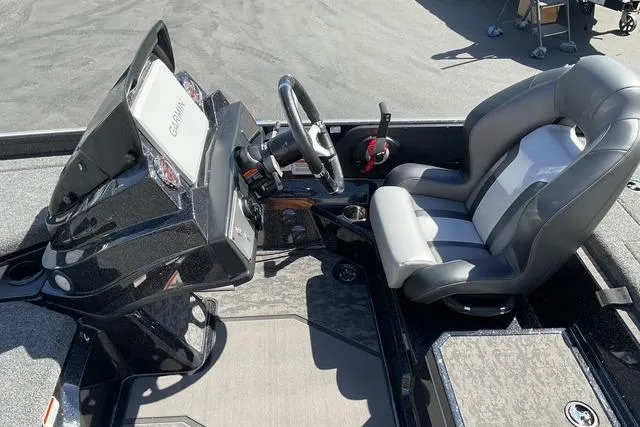 Slide: The Image of 2026 Nitro Z21 XL Pro boat cockpit with steering wheel and comfortable seating. - 10