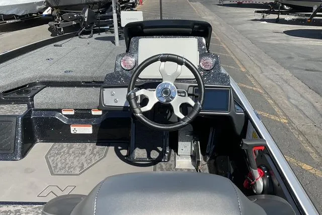 Slide: The Image of 2026 Nitro Z21 XL Pro boat cockpit with steering wheel and dashboard controls. - 16