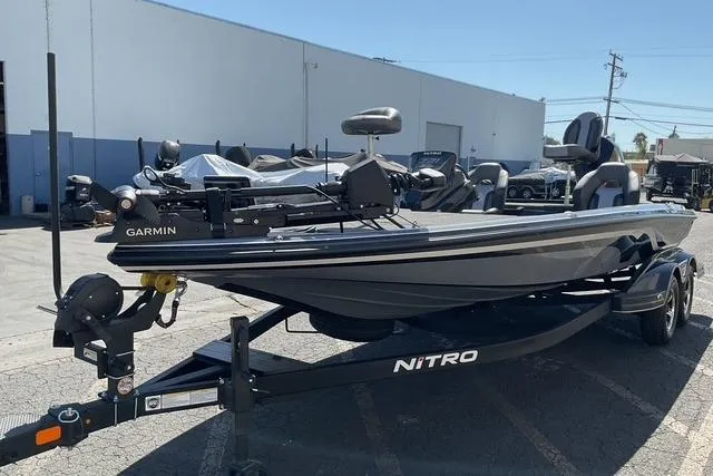 Slide: The Image of 2026 Nitro Z21 XL Pro boat on trailer, equipped with Garmin technology. - 3