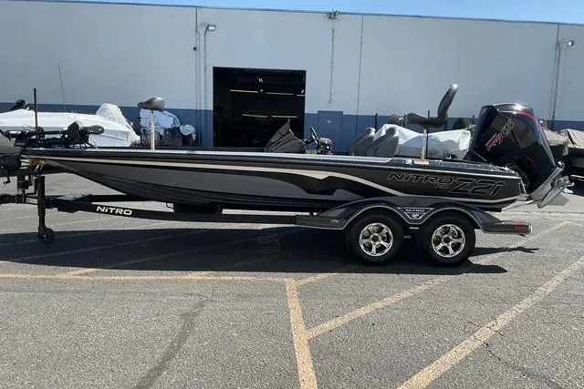 Slide: The Image of 2026 Nitro Z21 XL Pro boat on trailer in parking lot. - 8
