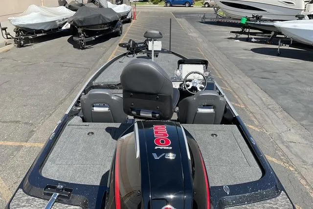 Slide: The Image of 2026 Nitro Z21 XL Pro boat with V8 engine, parked in a marina. - 9