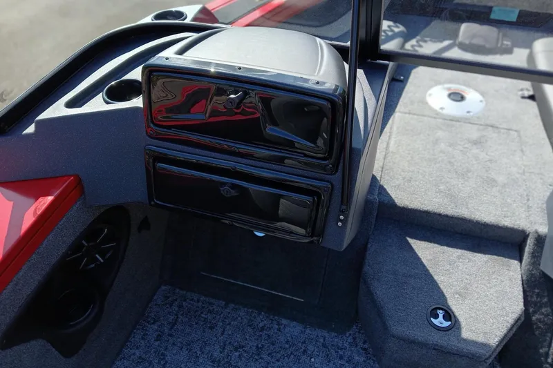 Slide: The Image of 2026 Tracker Targa V-18 Combo boat interior with dashboard and carpeted flooring. - 5