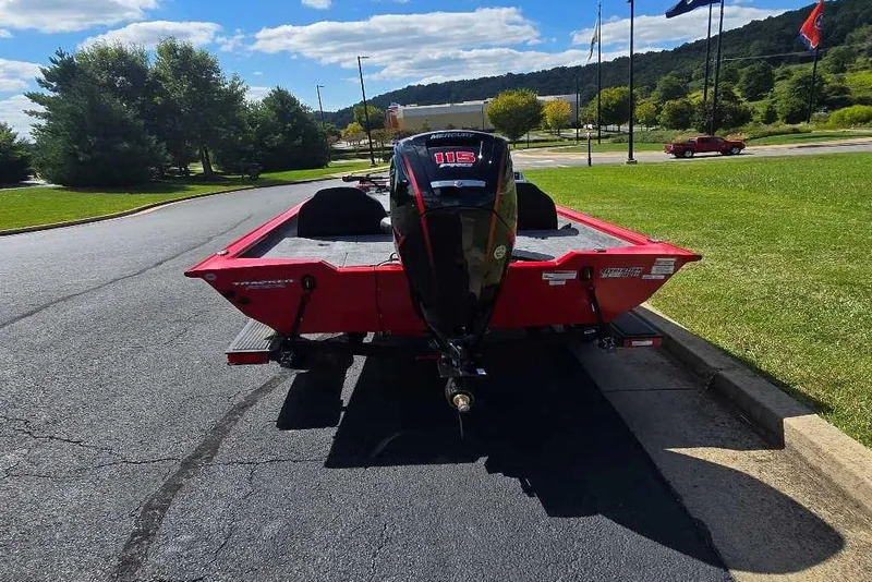 Slide: The Image of 2026 Tracker Pro Team 190 boat with Mercury 115 engine, parked on a sunny day. - 6