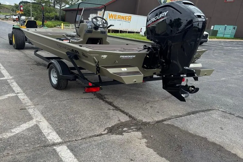 Slide: The Image of 2026 Tracker Grizzly 1860 CC boat on trailer with Mercury outboard motor. - 10