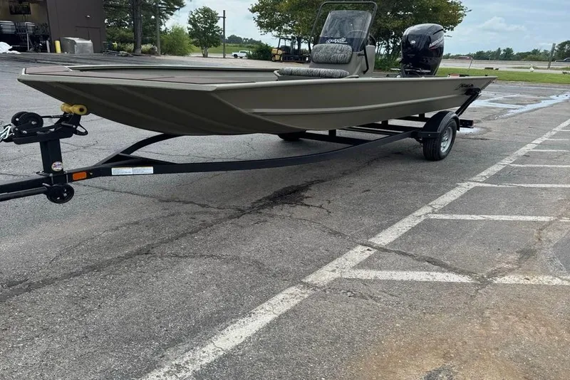 Slide: The Image of 2026 Tracker Grizzly 1860 CC boat on trailer in parking lot. - 3