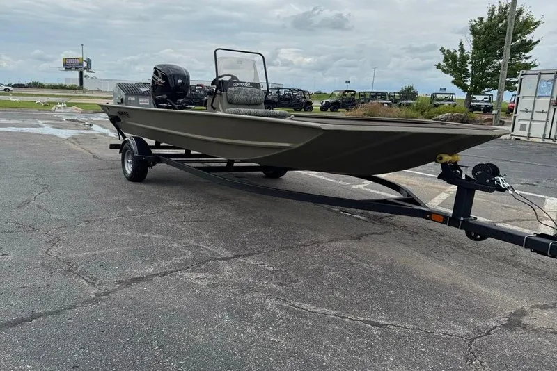 Slide: The Image of 2026 Tracker Grizzly 1860 CC boat on trailer in parking lot. - 7