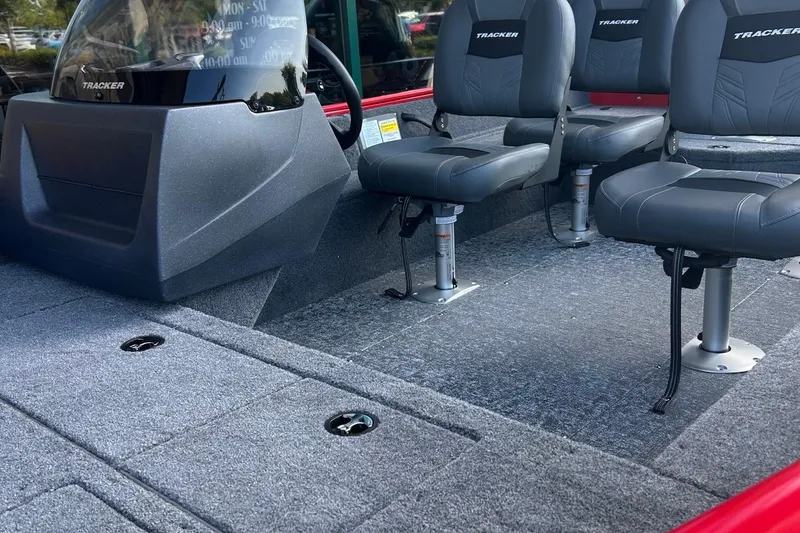 Slide: The Image of 2026 Tracker Pro Guide V-16 SC boat interior with seating and console. - 3