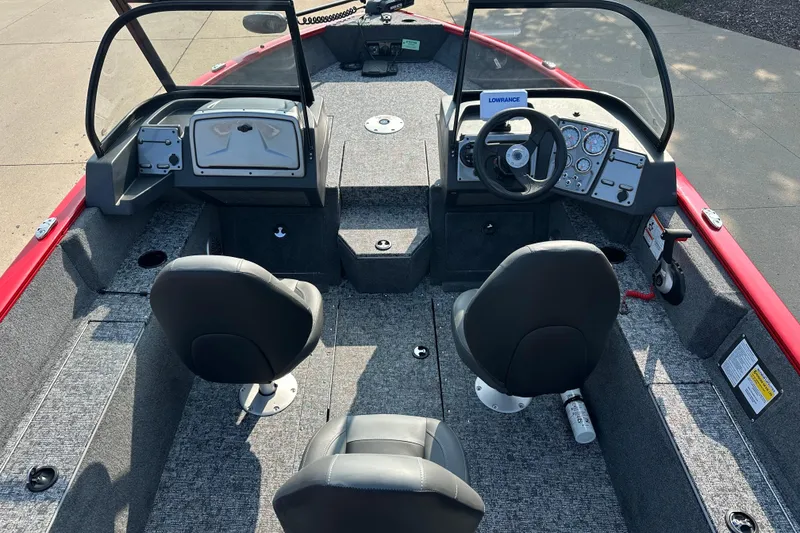 Slide: The Image of Interior of 2026 Tracker Pro Guide V-175 WT boat with dual seats and control panel. - 4