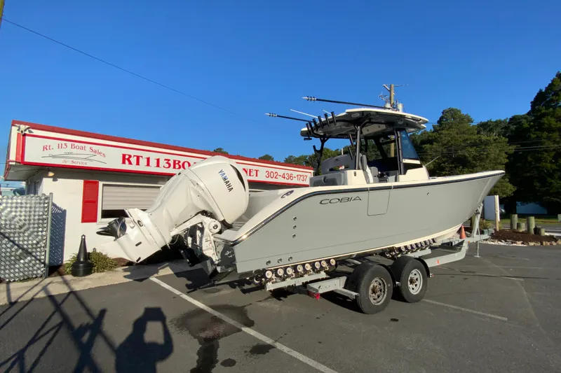 Slide: The Image of 2026 Cobia 305 Center Console boat on trailer at RT113 Boat Sales. - 12