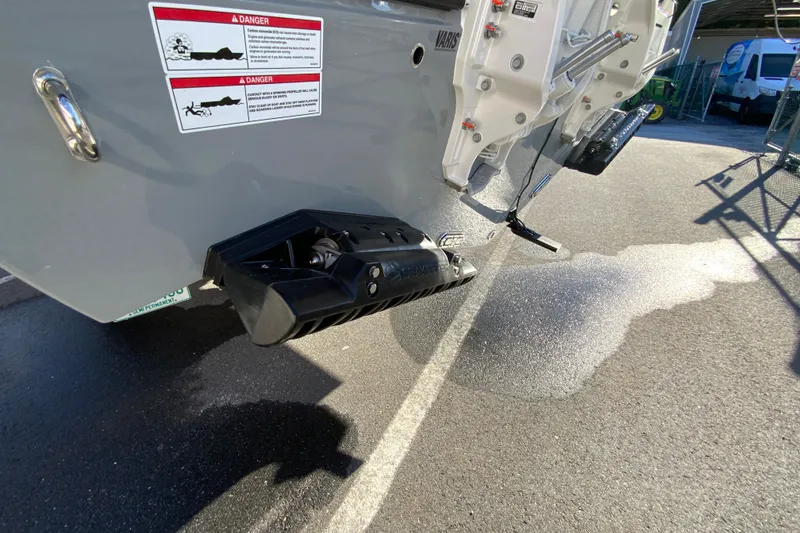 Slide: The Image of 2026 Cobia 305 Center Console boat stern with safety warnings and equipment details. - 14