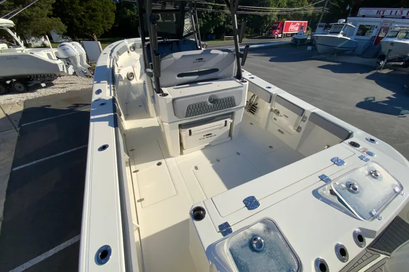 Slide: The Image of 2026 Cobia 305 Center Console boat interior with seating and storage compartments. - 15