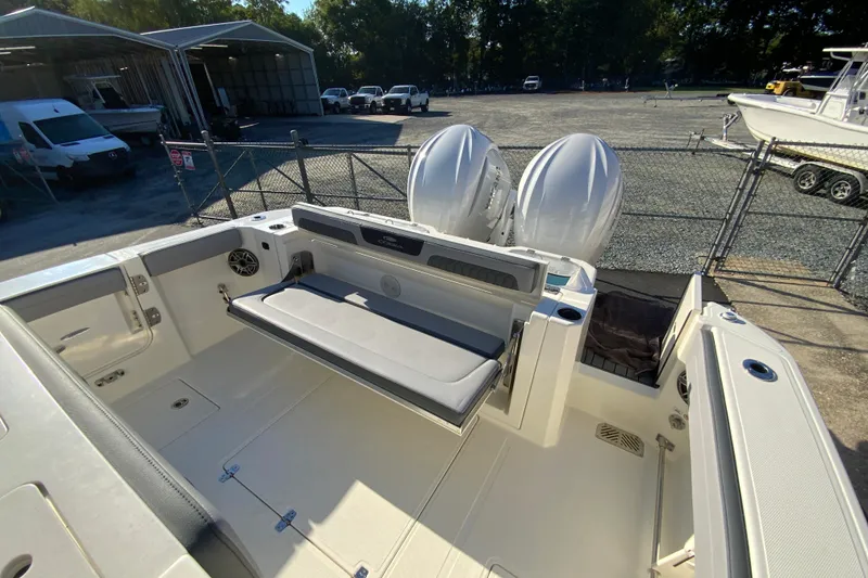 Slide: The Image of 2026 Cobia 305 Center Console boat with dual engines and spacious seating area. - 17