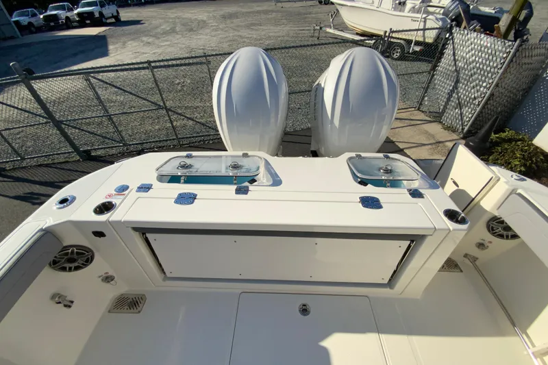 Slide: The Image of 2026 Cobia 305 Center Console boat with dual engines and fishing amenities. - 18