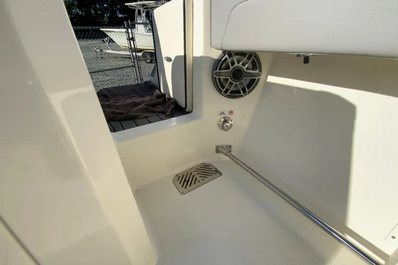 Slide: The Image of 2026 Cobia 305 Center Console interior with speaker and drainage system. - 21