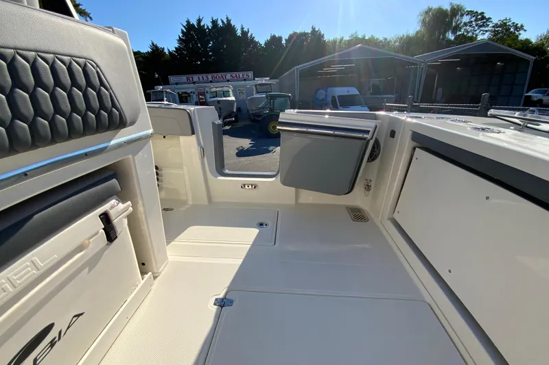 Slide: The Image of 2026 Cobia 305 Center Console boat interior at a boat sales lot. - 24