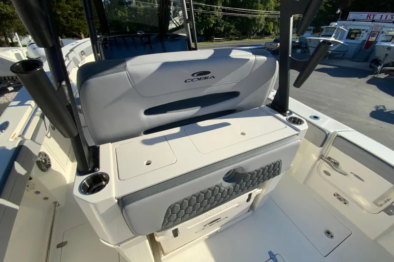 Slide: The Image of 2026 Cobia 305 Center Console boat interior with seating and storage features. - 29