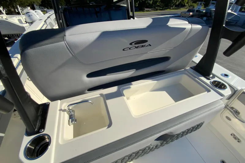 Slide: The Image of 2026 Cobia 305 Center Console boat interior with sink and storage compartments. - 30