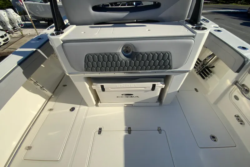 Slide: The Image of 2026 Cobia 305 Center Console boat interior with storage and seating area. - 34
