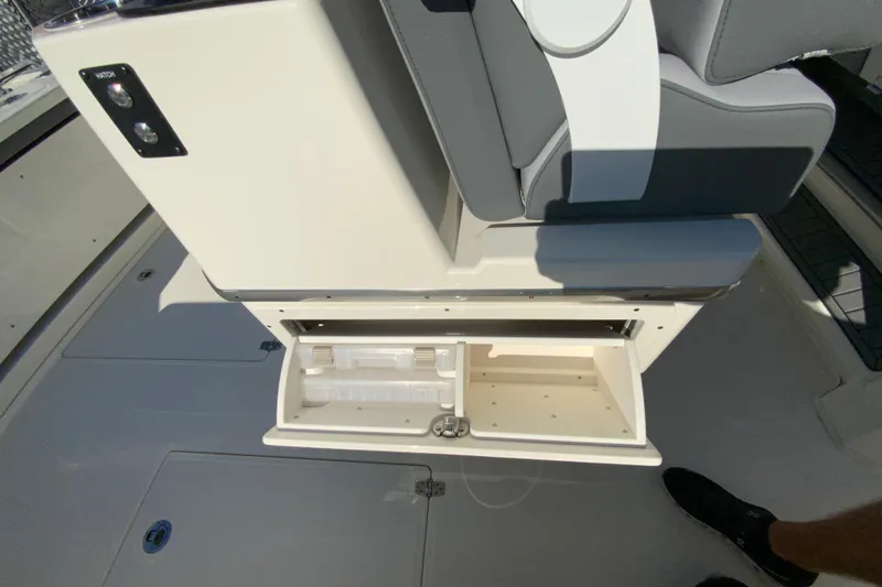 Slide: The Image of 2026 Cobia 305 Center Console boat interior with open storage compartment. - 37
