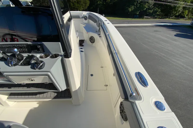 Slide: The Image of 2026 Cobia 305 Center Console boat interior with control panel and seating area. - 61