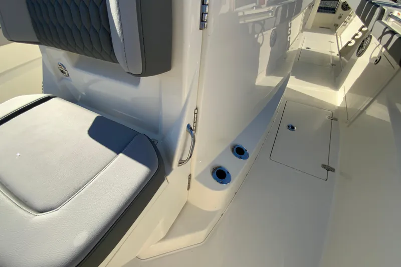 Slide: The Image of 2026 Cobia 305 Center Console interior with seating and storage compartments. - 76