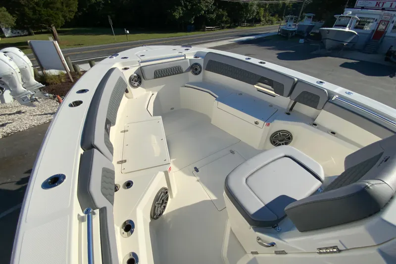 Slide: The Image of 2026 Cobia 305 Center Console boat interior with seating and storage compartments. - 81