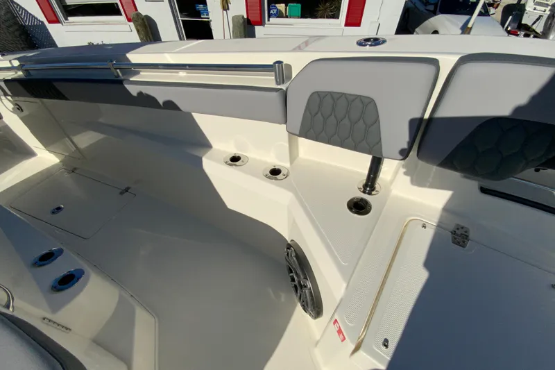 Slide: The Image of 2026 Cobia 305 Center Console boat interior with seating and storage compartments. - 85