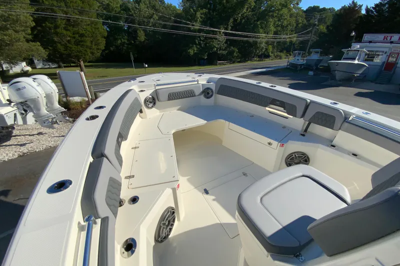 Slide: The Image of 2026 Cobia 305 Center Console boat interior with seating and storage compartments. - 87