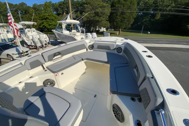Slide: The Image of 2026 Cobia 305 Center Console boat with spacious seating and modern design. - 90