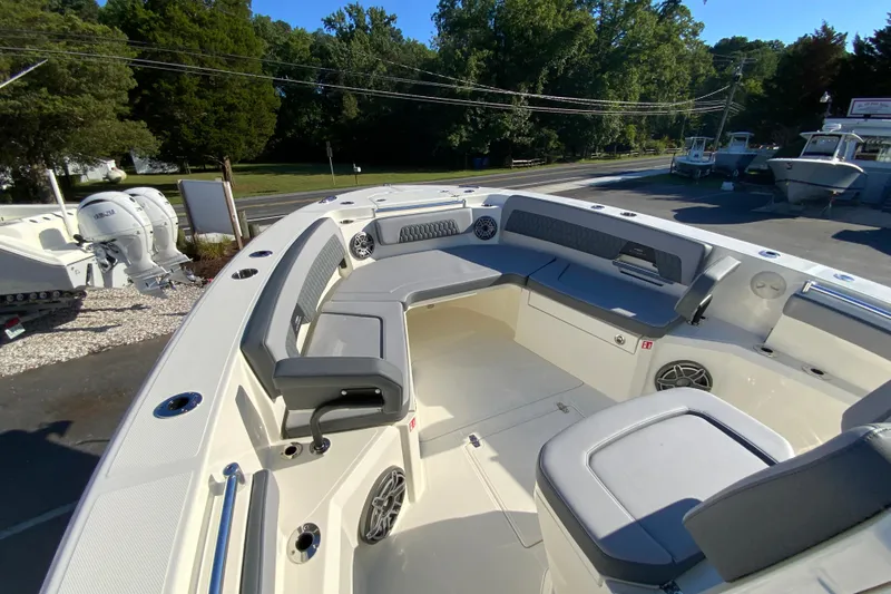 Slide: The Image of 2026 Cobia 305 Center Console boat with spacious seating and modern design. - 91