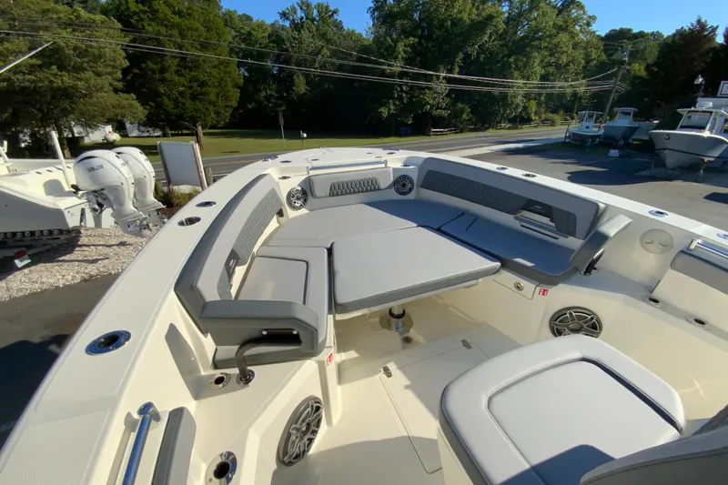 Slide: The Image of 2026 Cobia 305 Center Console boat with spacious seating and modern design. - 97