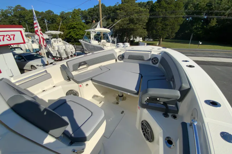 Slide: The Image of 2026 Cobia 305 Center Console boat with spacious seating and modern design. - 98