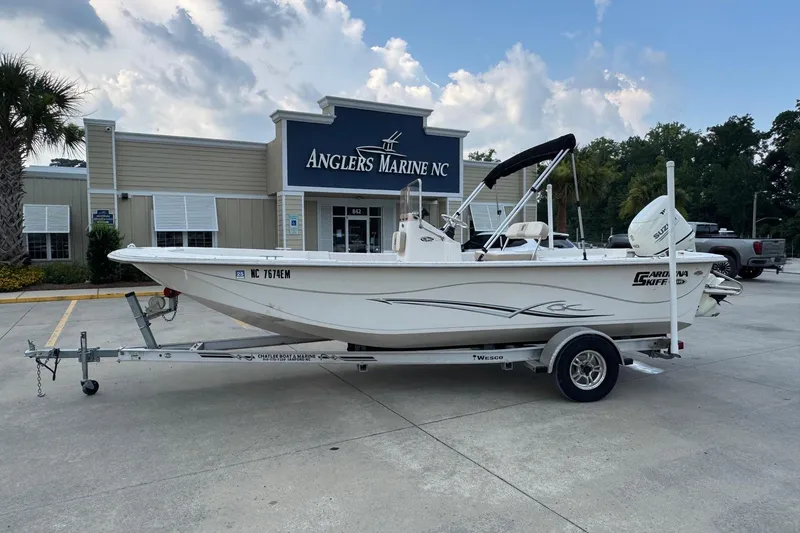 The Image of 2019 Carolina Skiff 218 DLV boat on trailer at Anglers Marine NC dealership. - 0