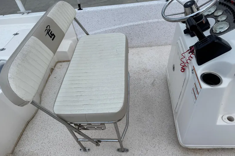 Slide: The Image of 2019 Carolina Skiff 218 DLV boat interior with steering console and seating. - 12