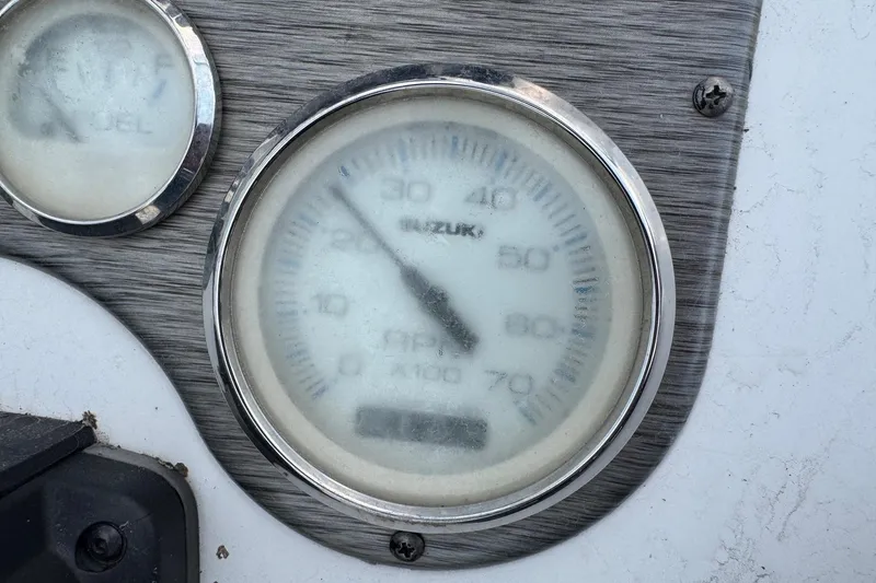 Slide: The Image of Close-up of a 2019 Carolina Skiff 218 DLV boat gauge panel. - 14