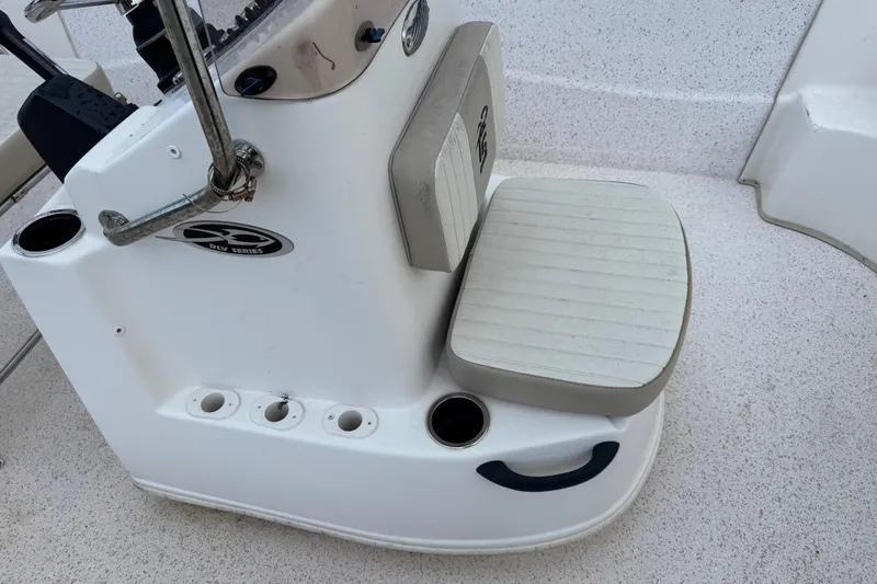 Slide: The Image of 2019 Carolina Skiff 218 DLV boat console with seating and cup holders. - 9