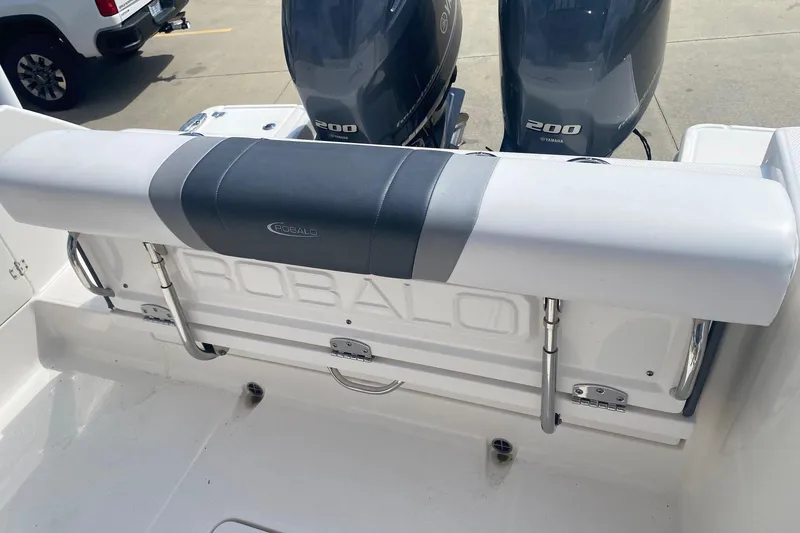 Slide: The Image of 2021 Robalo R272 Center Console boat with dual Yamaha 200 engines, rear seating view. - 11
