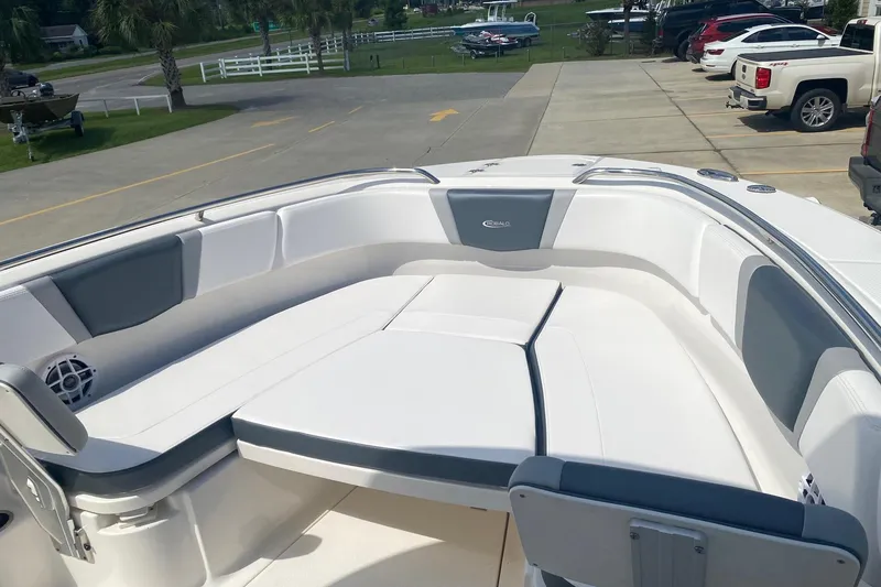 Slide: The Image of 2021 Robalo R272 Center Console boat with spacious seating area and sleek design. - 3