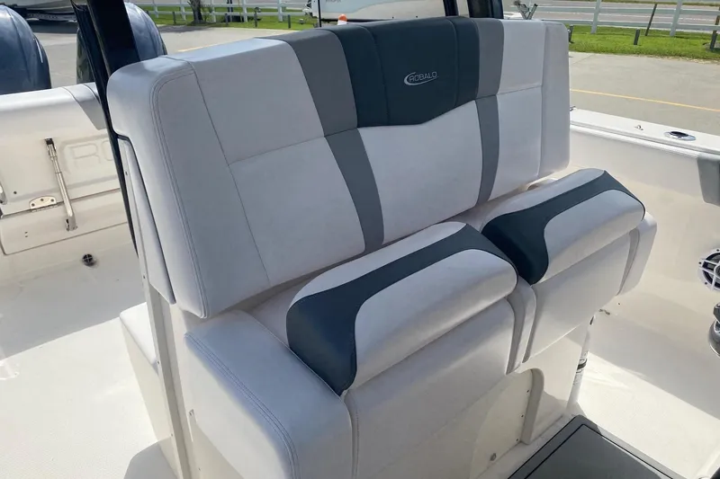 Slide: The Image of 2021 Robalo R272 Center Console boat seating, featuring gray and white cushioned design. - 6