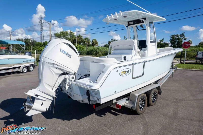 Slide: The Image of 2025 Sea Hunt Ultra 245 SE boat on trailer with Yamaha outboard engine. - 12