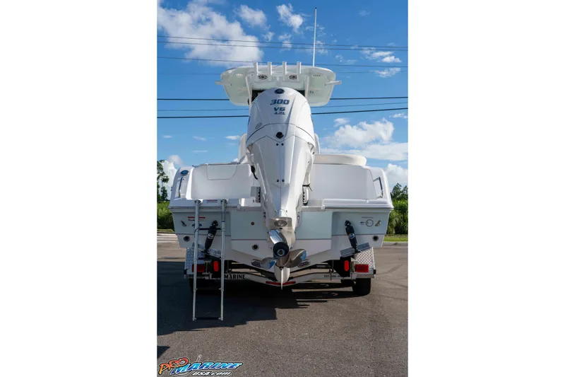 Slide: The Image of 2025 Sea Hunt Ultra 245 SE boat with powerful 300 V6 engine, rear view. - 28