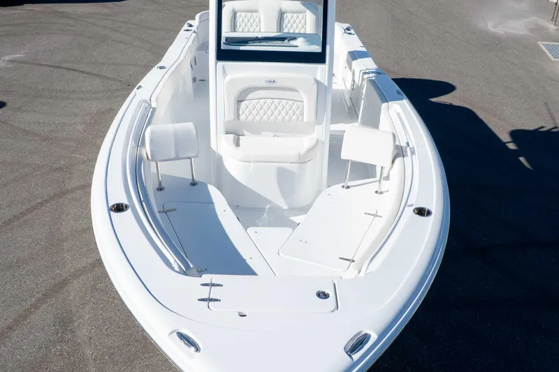 Slide: The Image of 2025 Sea Hunt Ultra 245 SE boat with spacious seating and sleek design. - 29