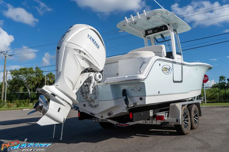 Slide: The Image of 2025 Sea Hunt Ultra 245 SE boat on trailer with Yamaha outboard motor. - 32