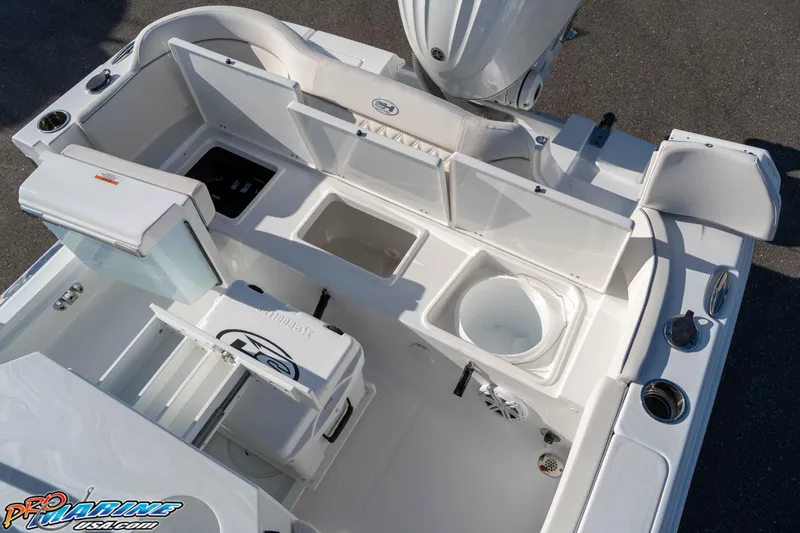 Slide: The Image of 2025 Sea Hunt Ultra 245 SE boat interior with storage compartments and seating. - 40