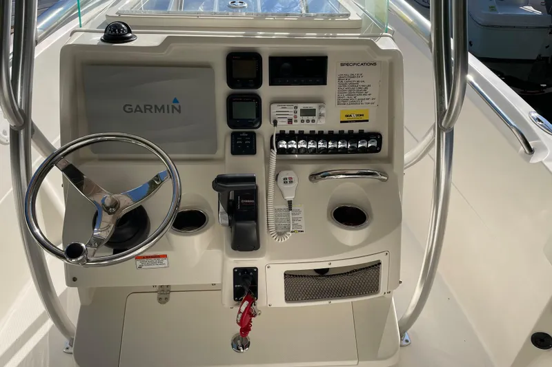 Slide: The Image of 2014 Sailfish 220 CC boat console with Garmin navigation and control panel. - 4