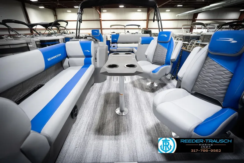 Slide: The Image of Interior of 2026 Bennington 22 SSB pontoon boat with blue and gray seating. - 16