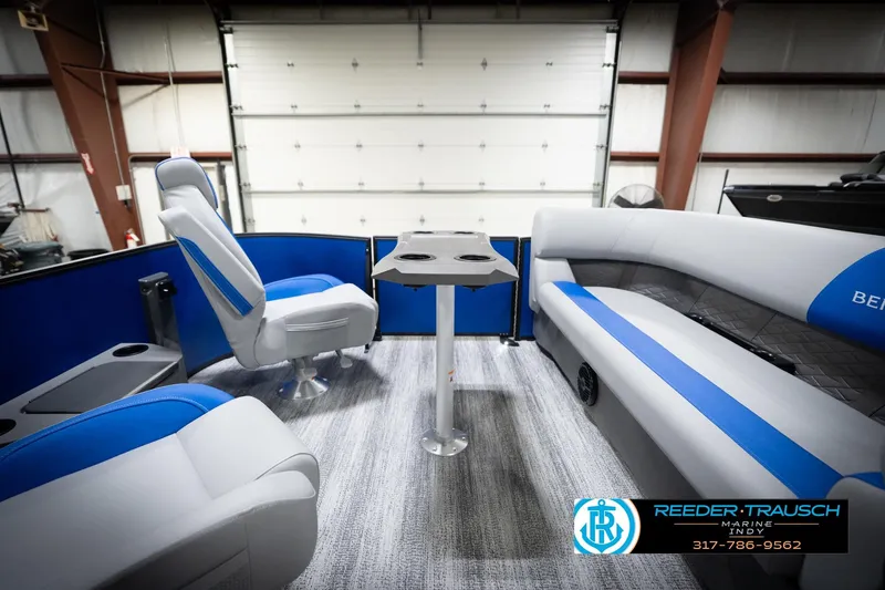 Slide: The Image of Interior of 2026 Bennington 22 SSB pontoon boat with blue and gray seating. - 21