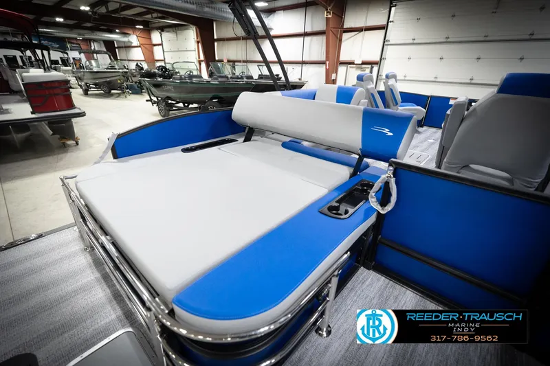 Slide: The Image of 2026 Bennington 22 SSB boat dashboard with steering wheel and navigation system. - 32